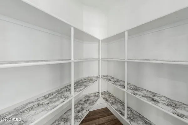 an empty room with a empty space and windows