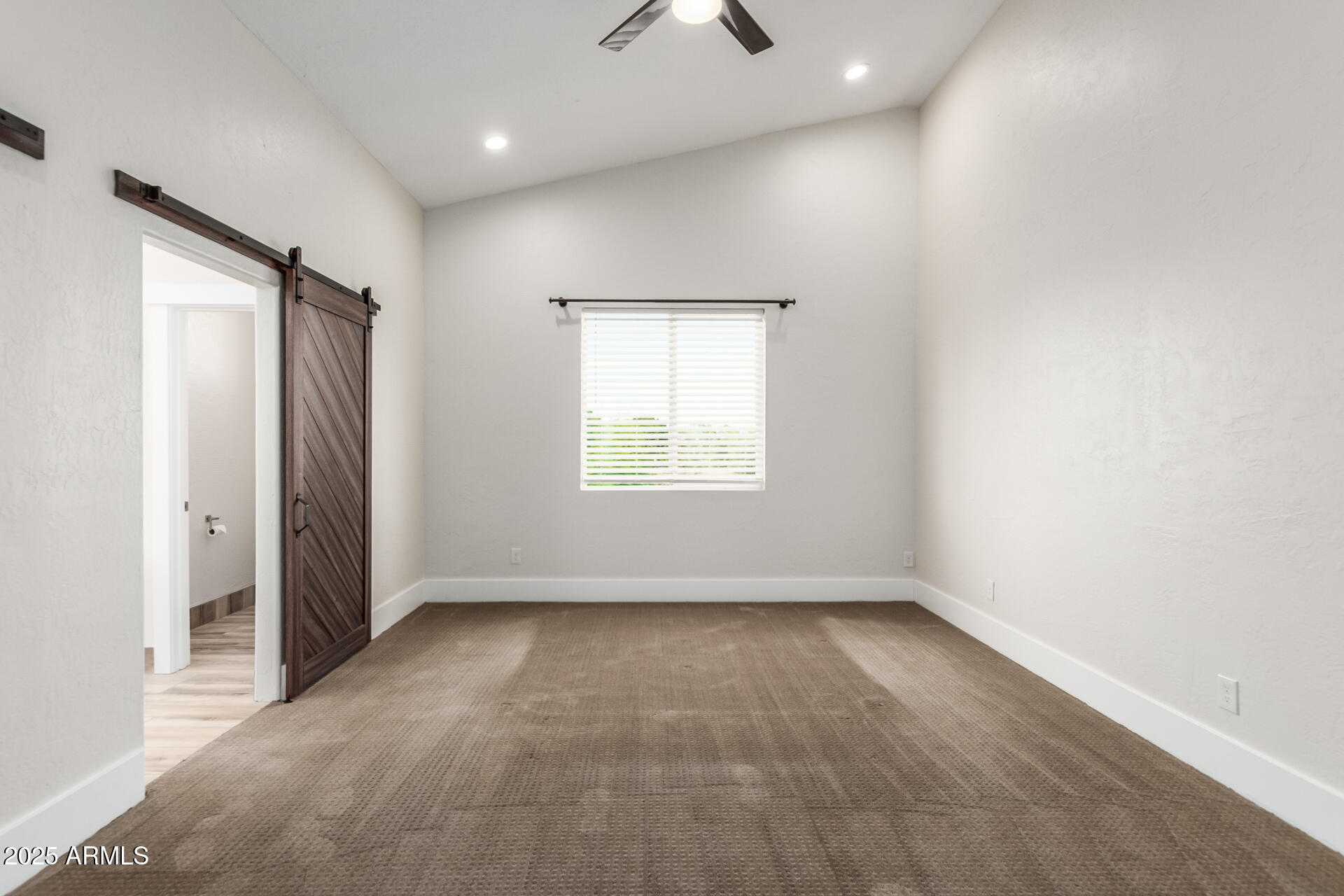 1874 West San Angelo Street Gilbert, AZ 85233 - Photo 19 of 55 an empty room with a empty space and windows
