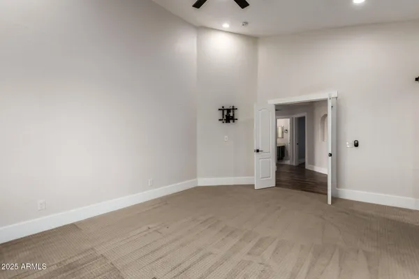 a spacious bathroom with a double vanity sink and mirror