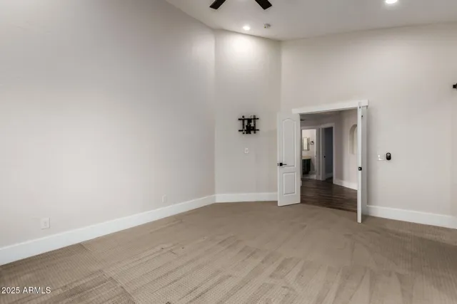 a spacious bathroom with a double vanity sink and mirror