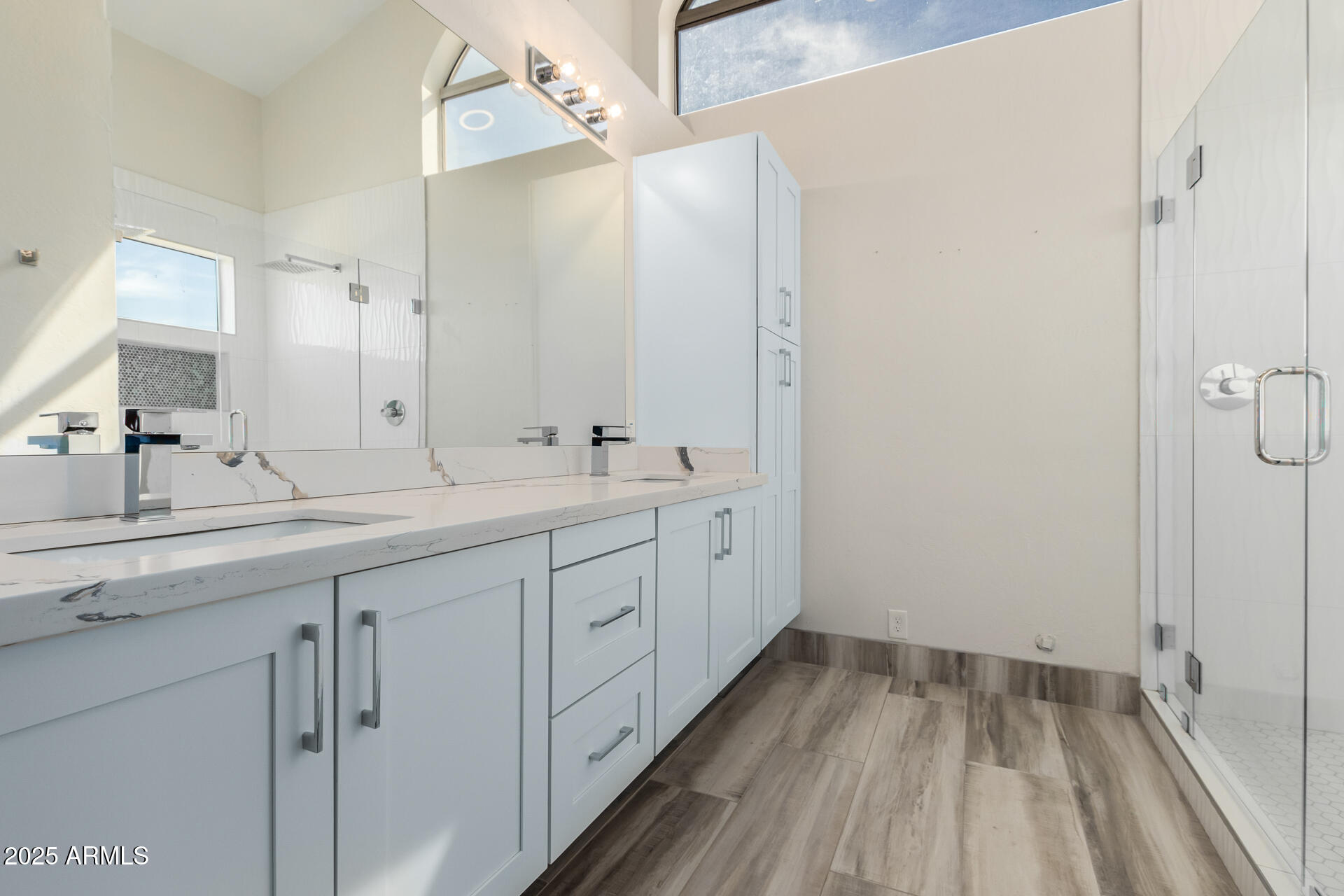 1874 West San Angelo Street Gilbert, AZ 85233 - Photo 23 of 55 a spacious bathroom with a double vanity sink and mirror