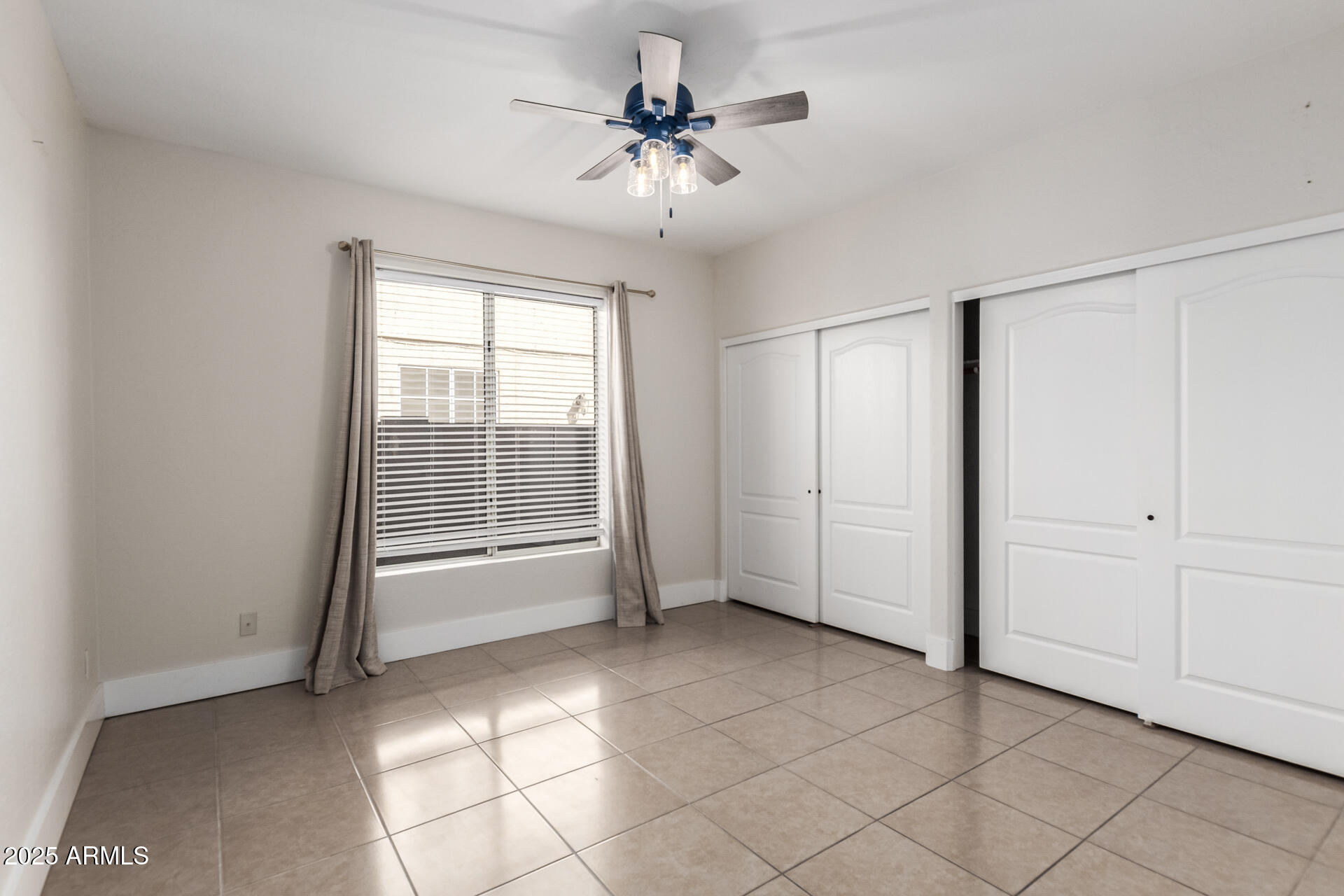 1874 West San Angelo Street Gilbert, AZ 85233 - Photo 25 of 55 a view of an empty room with a window