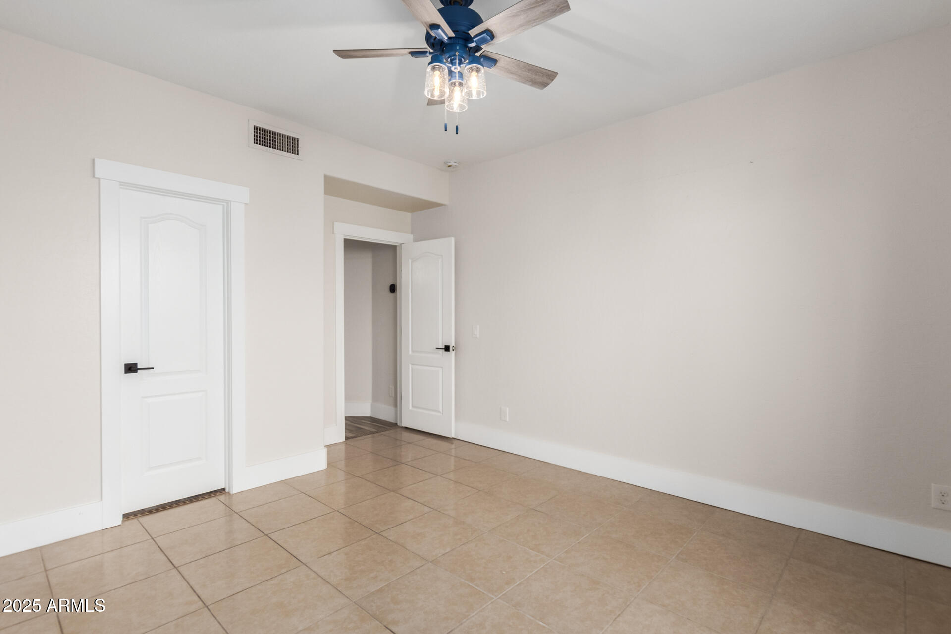 1874 West San Angelo Street Gilbert, AZ 85233 - Photo 26 of 55 a view of an empty room and chandelier fan