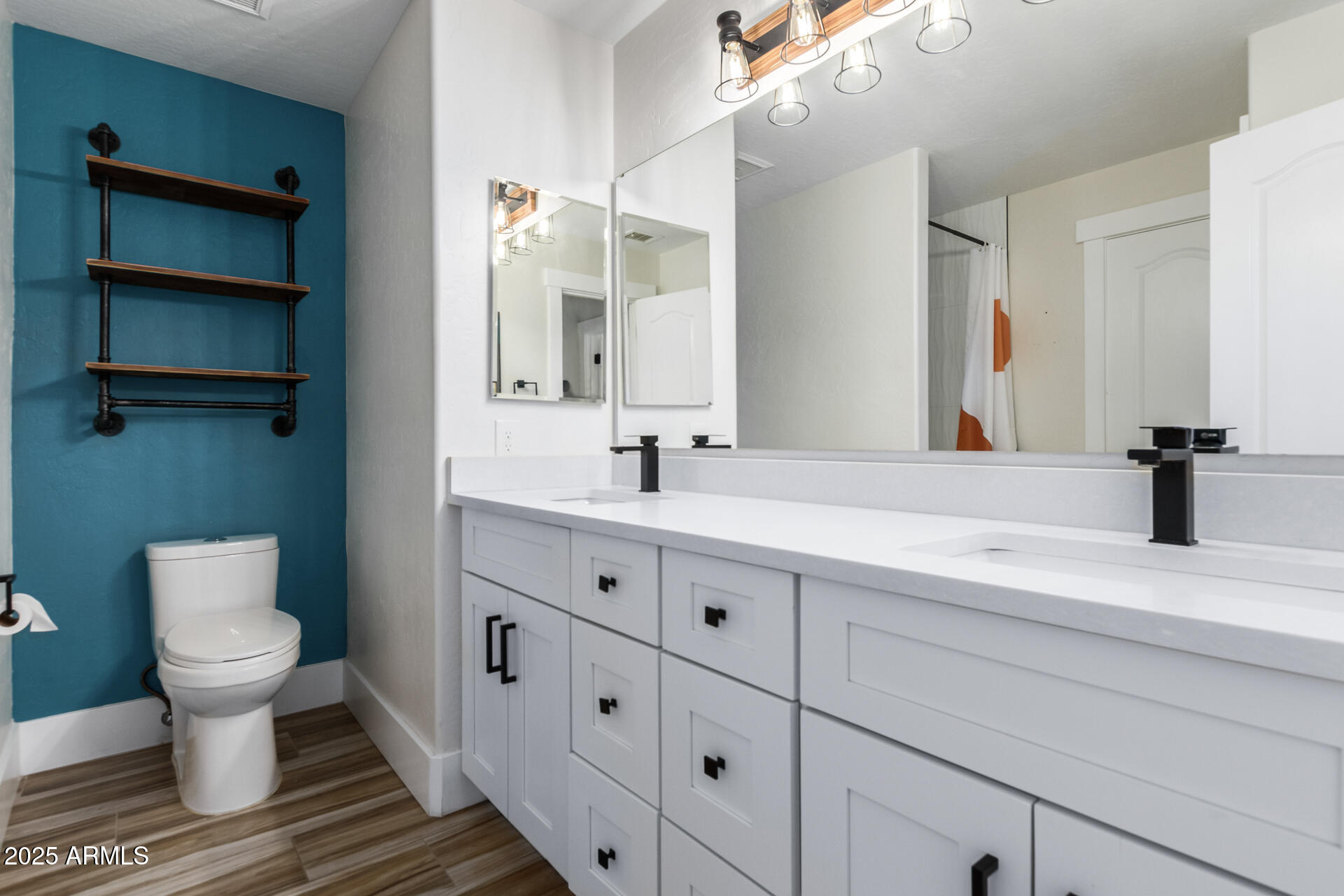 1874 West San Angelo Street Gilbert, AZ 85233 - Photo 30 of 55 a bathroom with a double vanity sink and a toilet