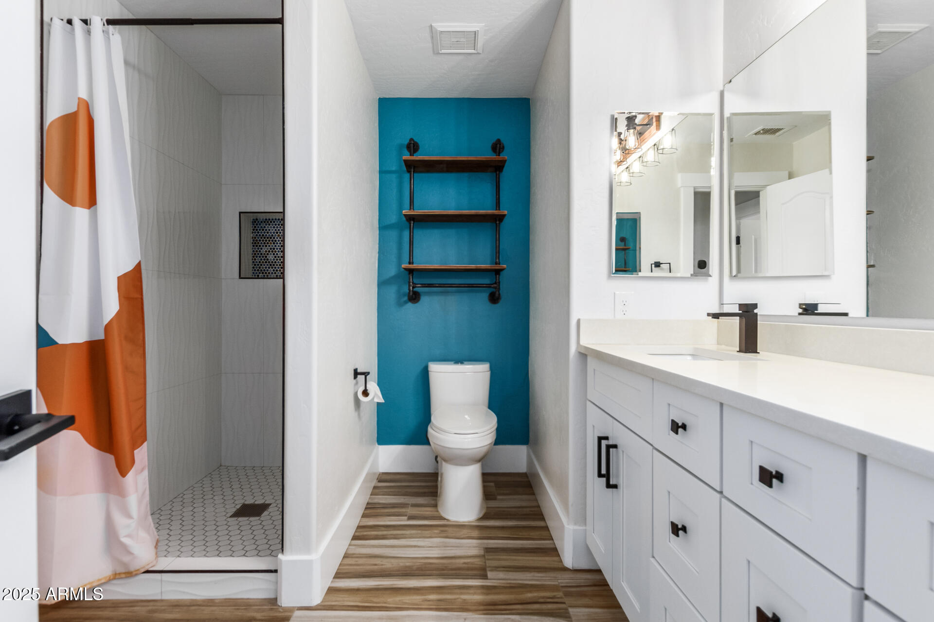 1874 West San Angelo Street Gilbert, AZ 85233 - Photo 31 of 55 a bathroom with a sink and mirror