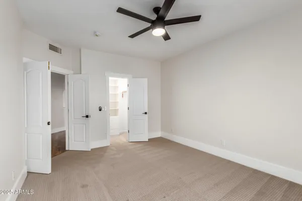 a bathroom with a sink vanity and mirror
