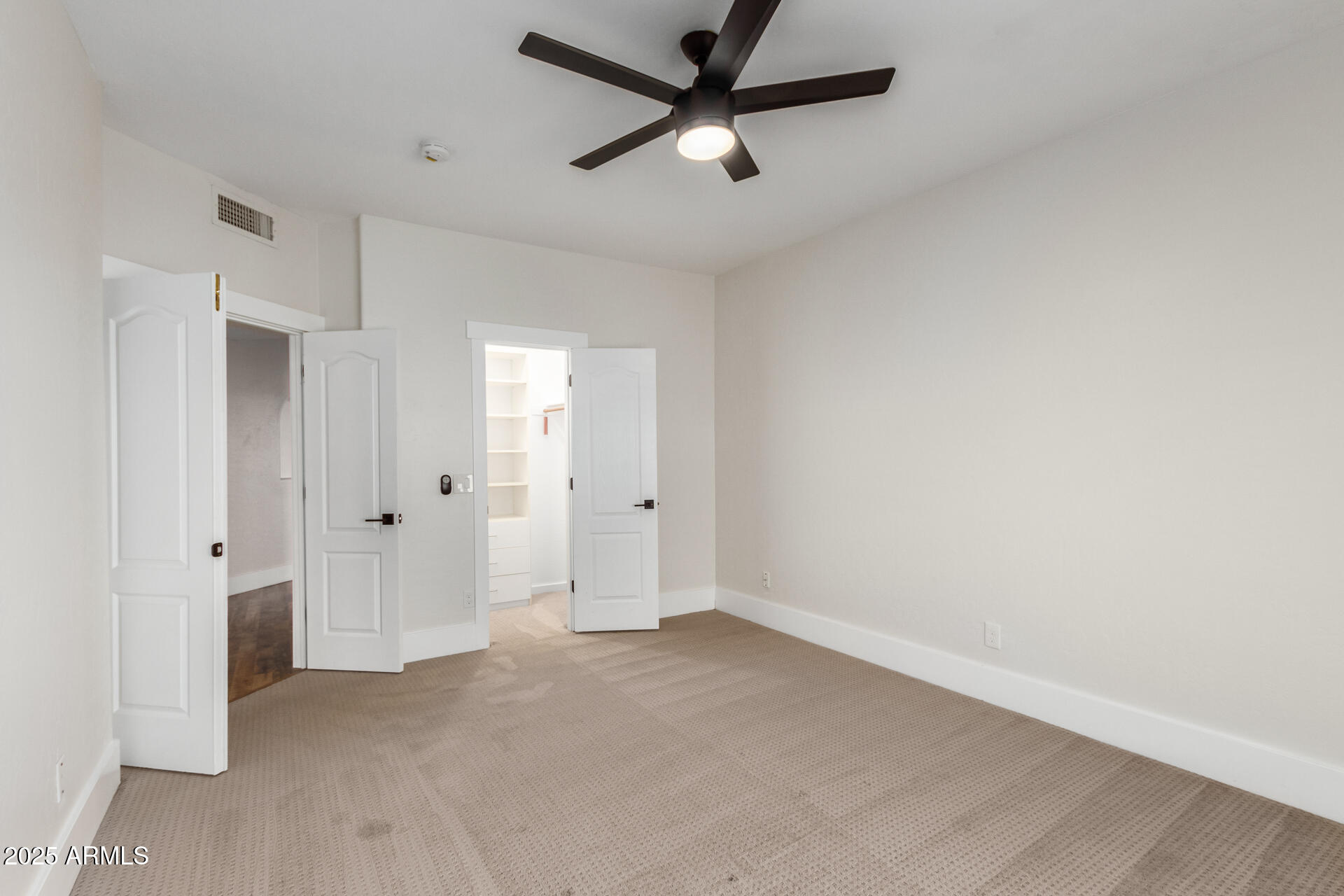 1874 West San Angelo Street Gilbert, AZ 85233 - Photo 35 of 55 an empty room with closet and windows