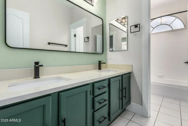 a kitchen with granite countertop a refrigerator and a sink