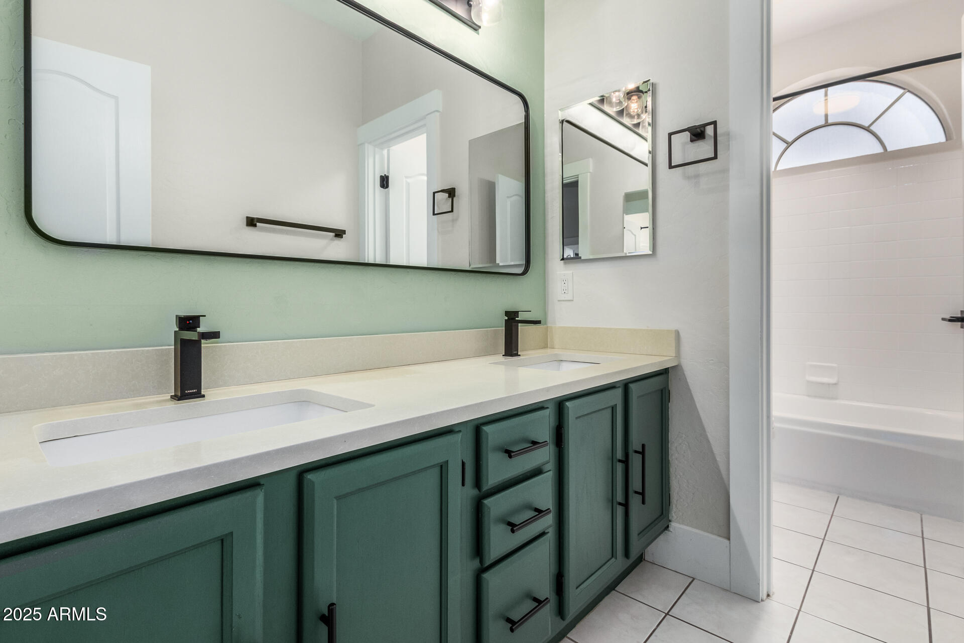 1874 West San Angelo Street Gilbert, AZ 85233 - Photo 38 of 55 a bathroom with a sink vanity and mirror