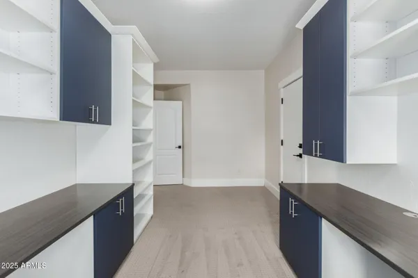 a view of a chairs and table in the balcony