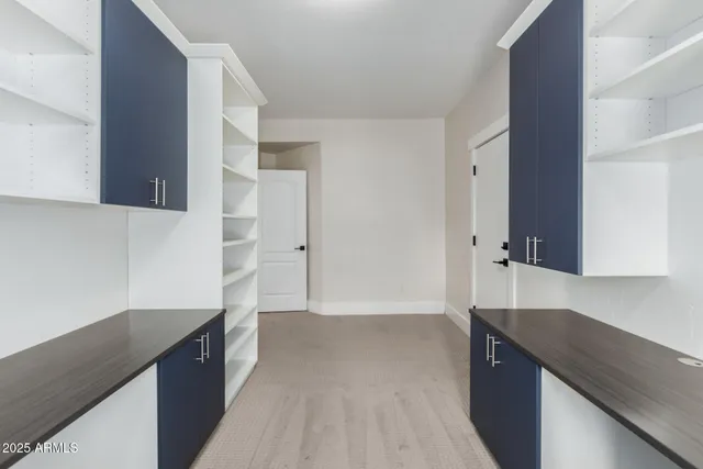 a view of a chairs and table in the balcony