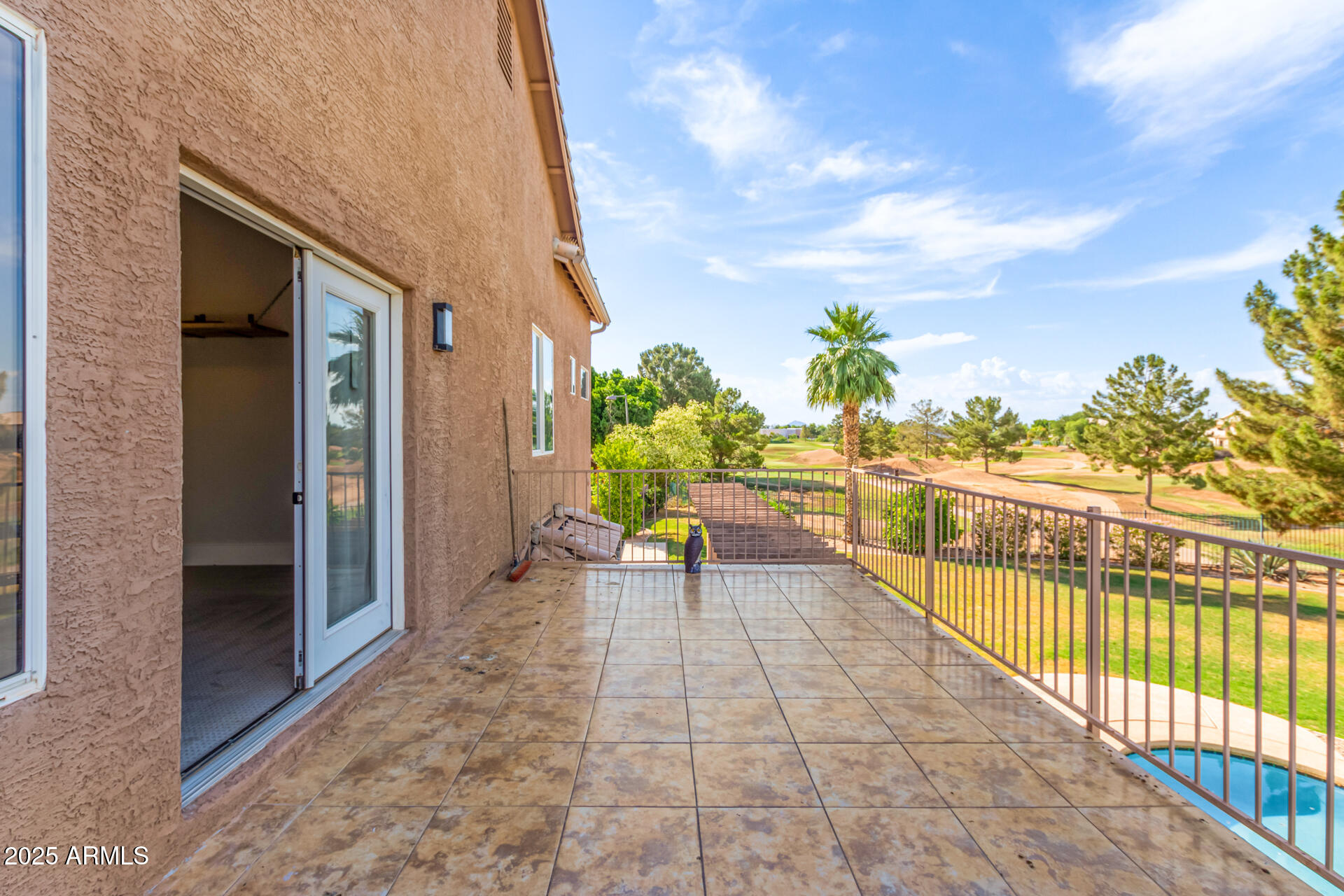 1874 West San Angelo Street Gilbert, AZ 85233 - Photo 45 of 55 a view of a chairs and table in the balcony