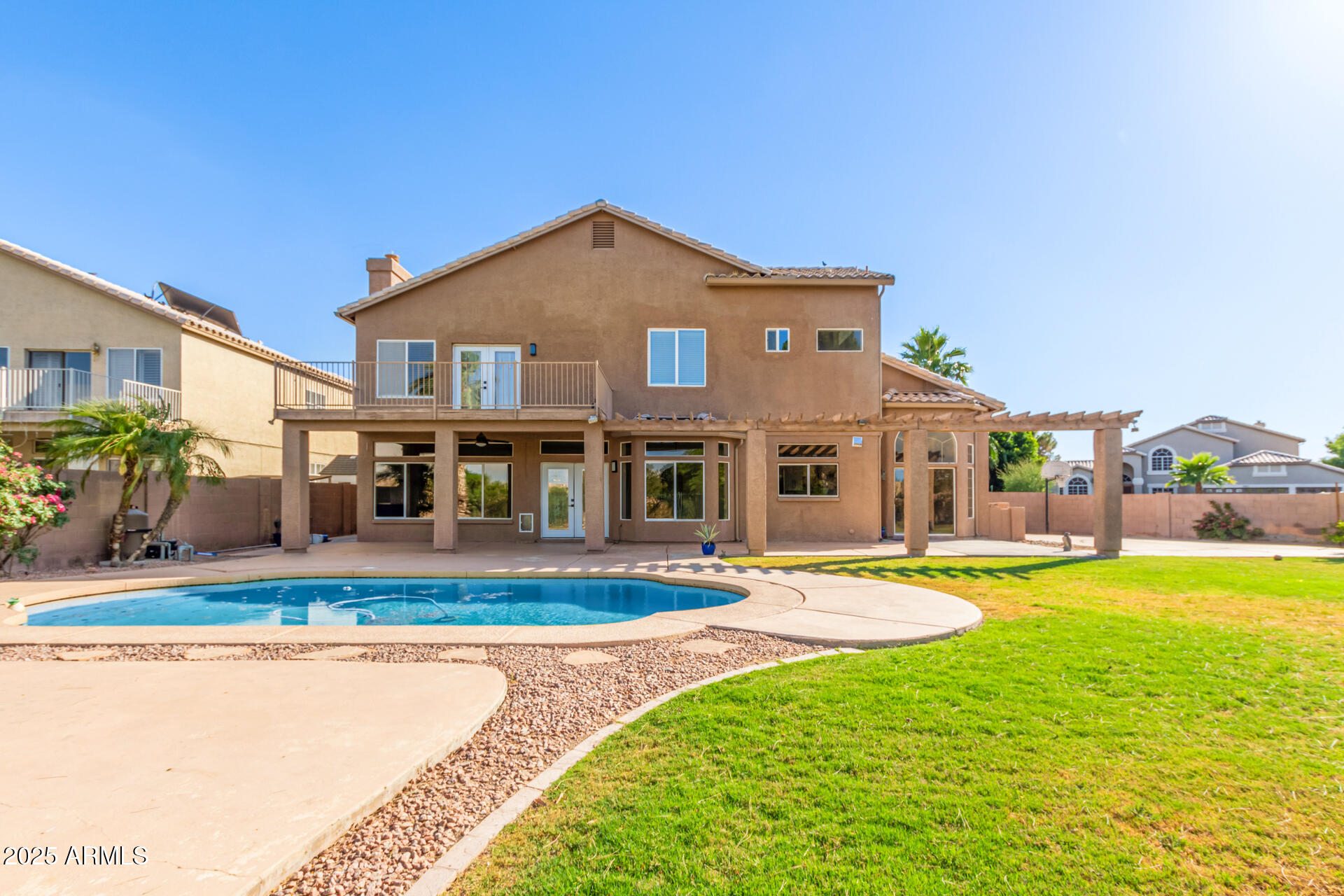 1874 West San Angelo Street Gilbert, AZ 85233 - Photo 48 of 55 a front view of a house with swimming pool