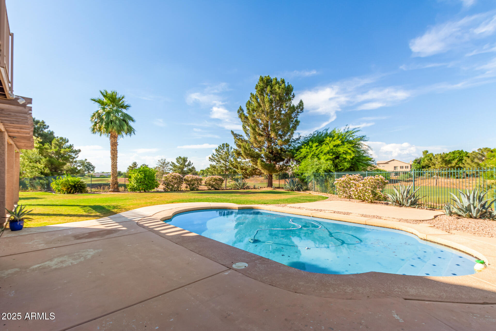 1874 West San Angelo Street Gilbert, AZ 85233 - Photo 50 of 55 a view of a swimming pool and a yard