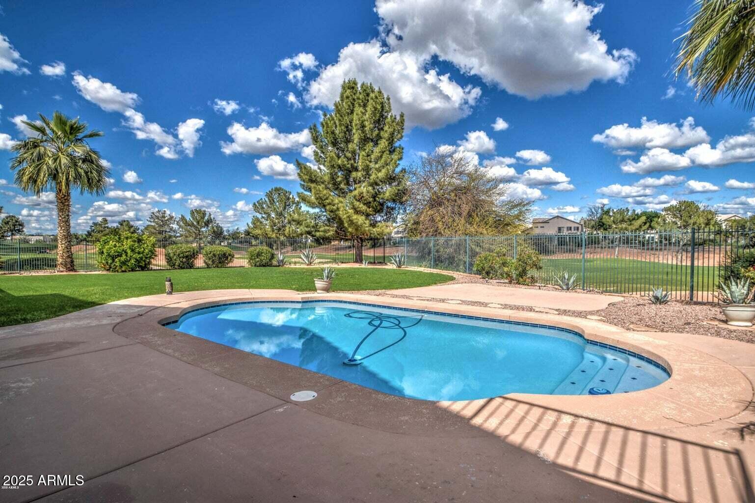 1874 West San Angelo Street Gilbert, AZ 85233 - Photo 51 of 55 a view of a swimming pool with an outdoor space and seating area