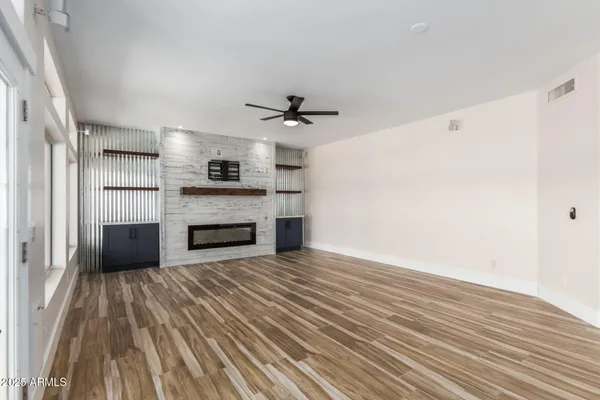 a view of a kitchen with a stove cabinets and wooden floor