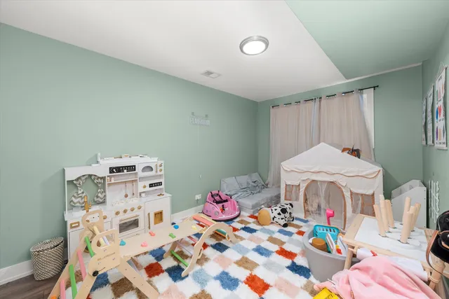 a bed room with a bed and a dresser