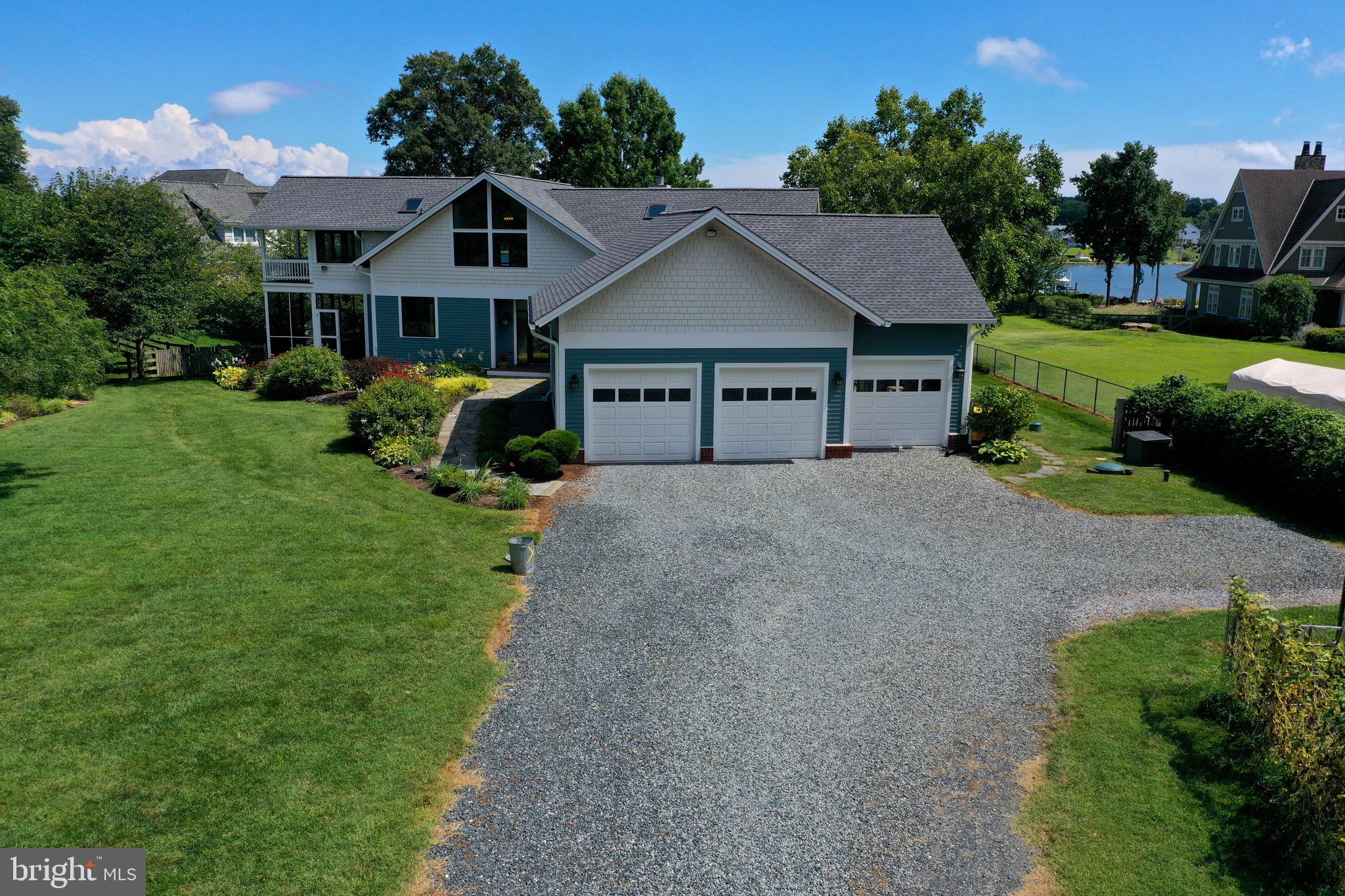 4168 Cadle Creek Road Edgewater, MD 21037 - Photo 2 of 80 Wide gravel driveway entrance with 3 car garage.
