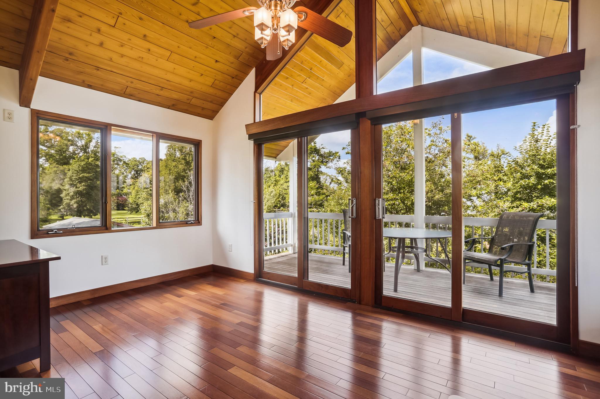 4168 Cadle Creek Road Edgewater, MD 21037 - Photo 40 of 80 Bedroom 2 dual sliding doors to covered porch.