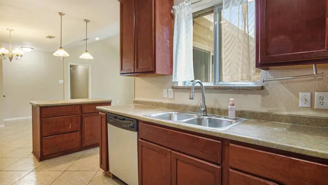 a kitchen with a sink and a window