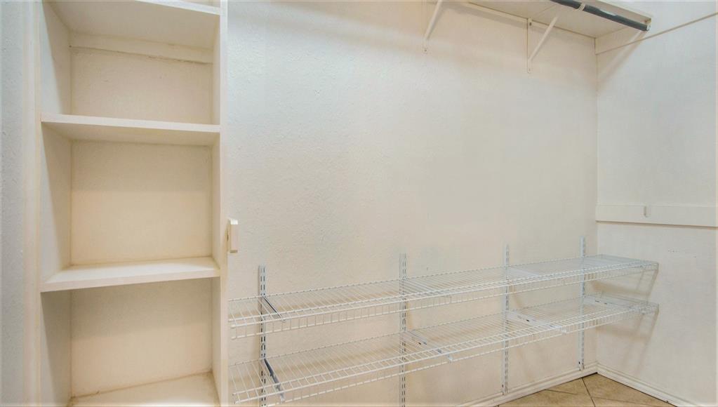 7600 Silveridge Drive Fort Worth, TX 76133 - Photo 16 of 24 a bathroom with a glass shower door