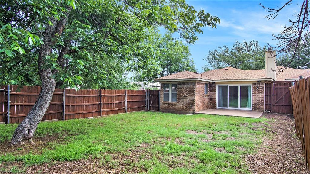 7600 Silveridge Drive Fort Worth, TX 76133 - Photo 21 of 24 a view of a house with a yard and sitting area