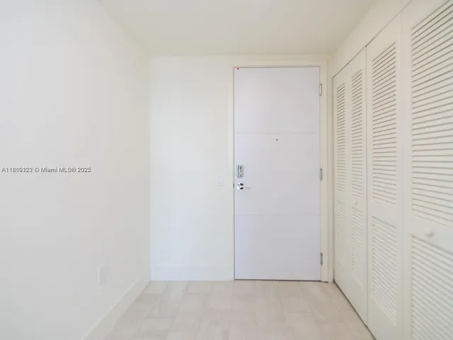 a kitchen with a refrigerator and a sink
