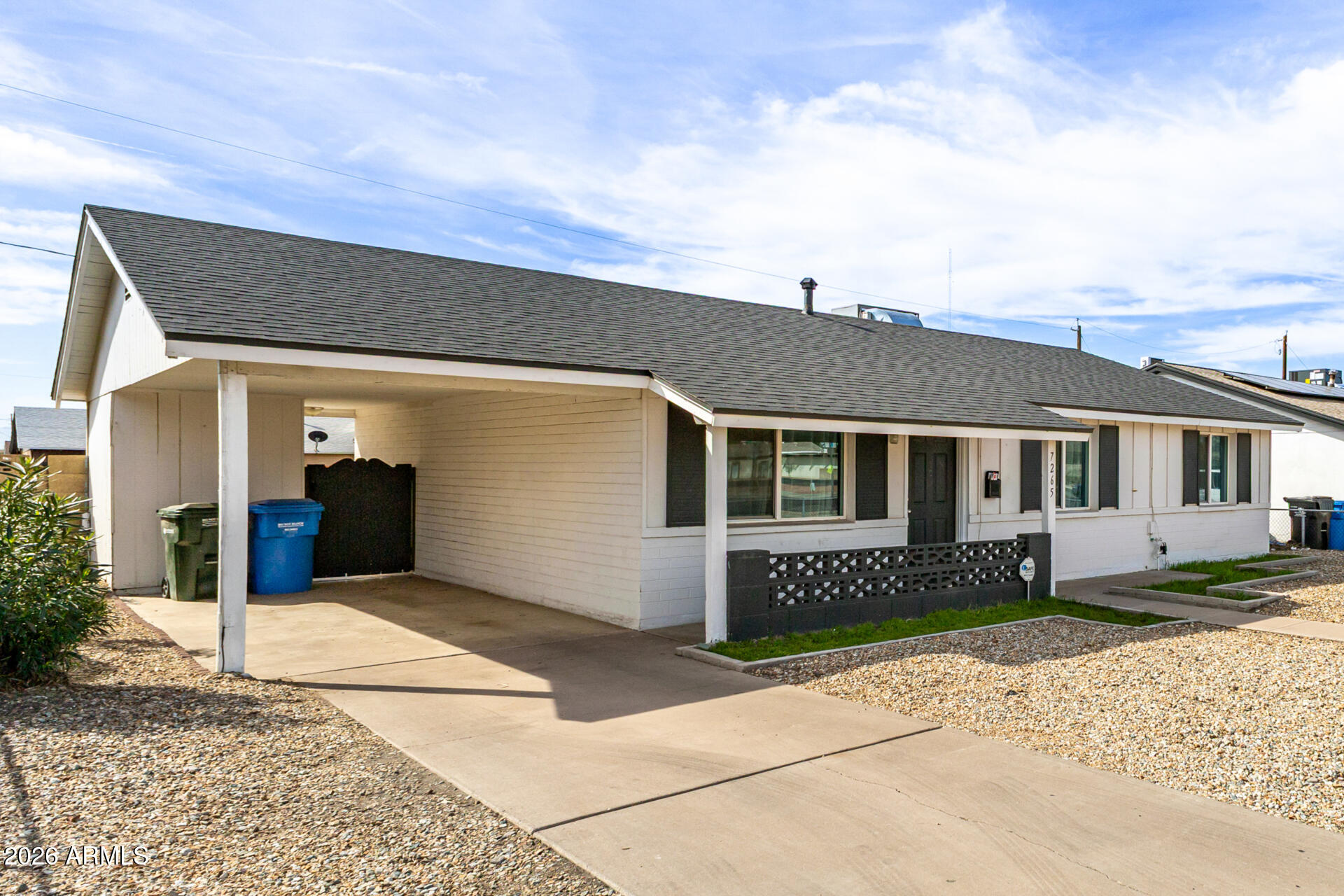 7265 West Camelback Road Phoenix, AZ 85033 - Photo 7 of 31 a front view of a house with a yard