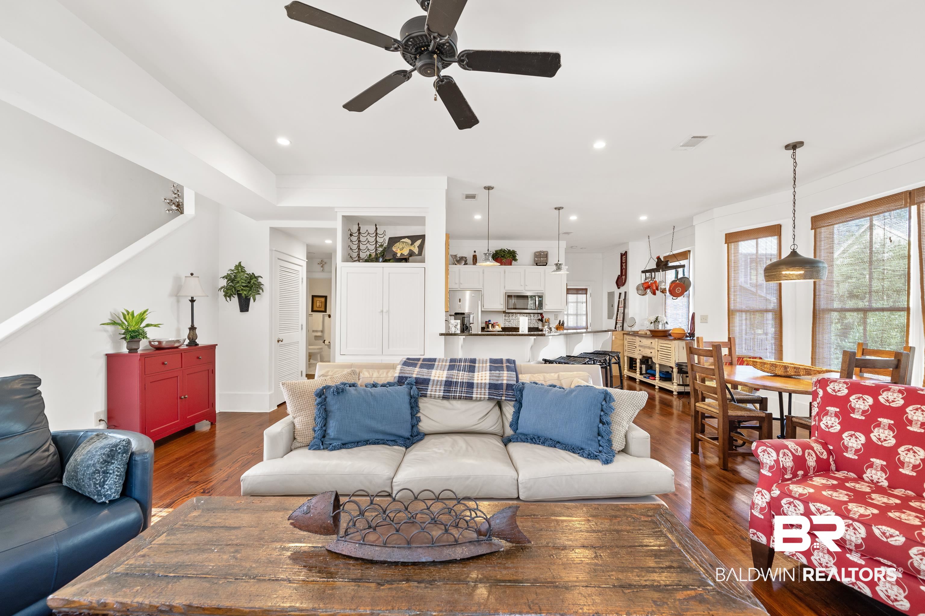 25773 Canal Road, Unit 10 Orange Beach, AL 36561 - Photo 6 of 40 Living room with beautiful hardwood floors and ceiling fan