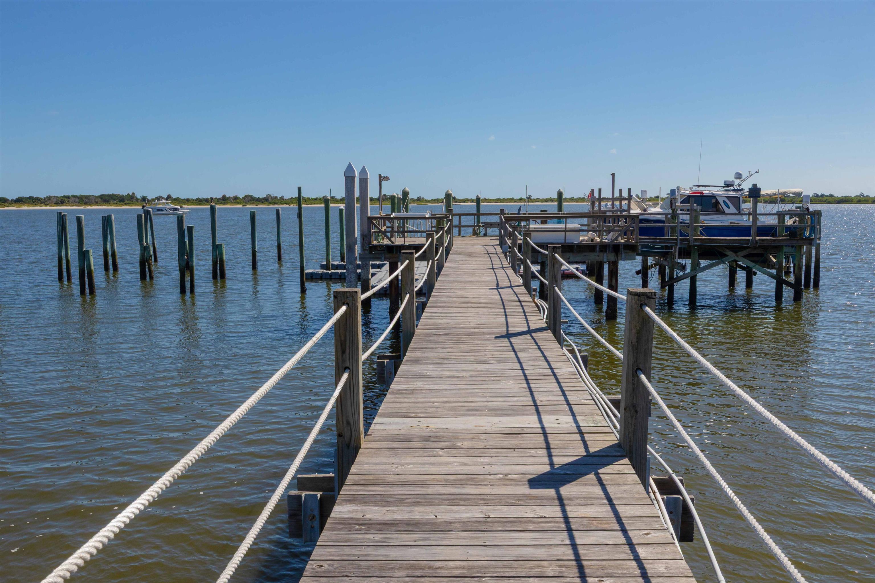 124 Inlet Drive St. Augustine, FL 32080 - Photo 11 of 45 a view of wooden balcony with seating space