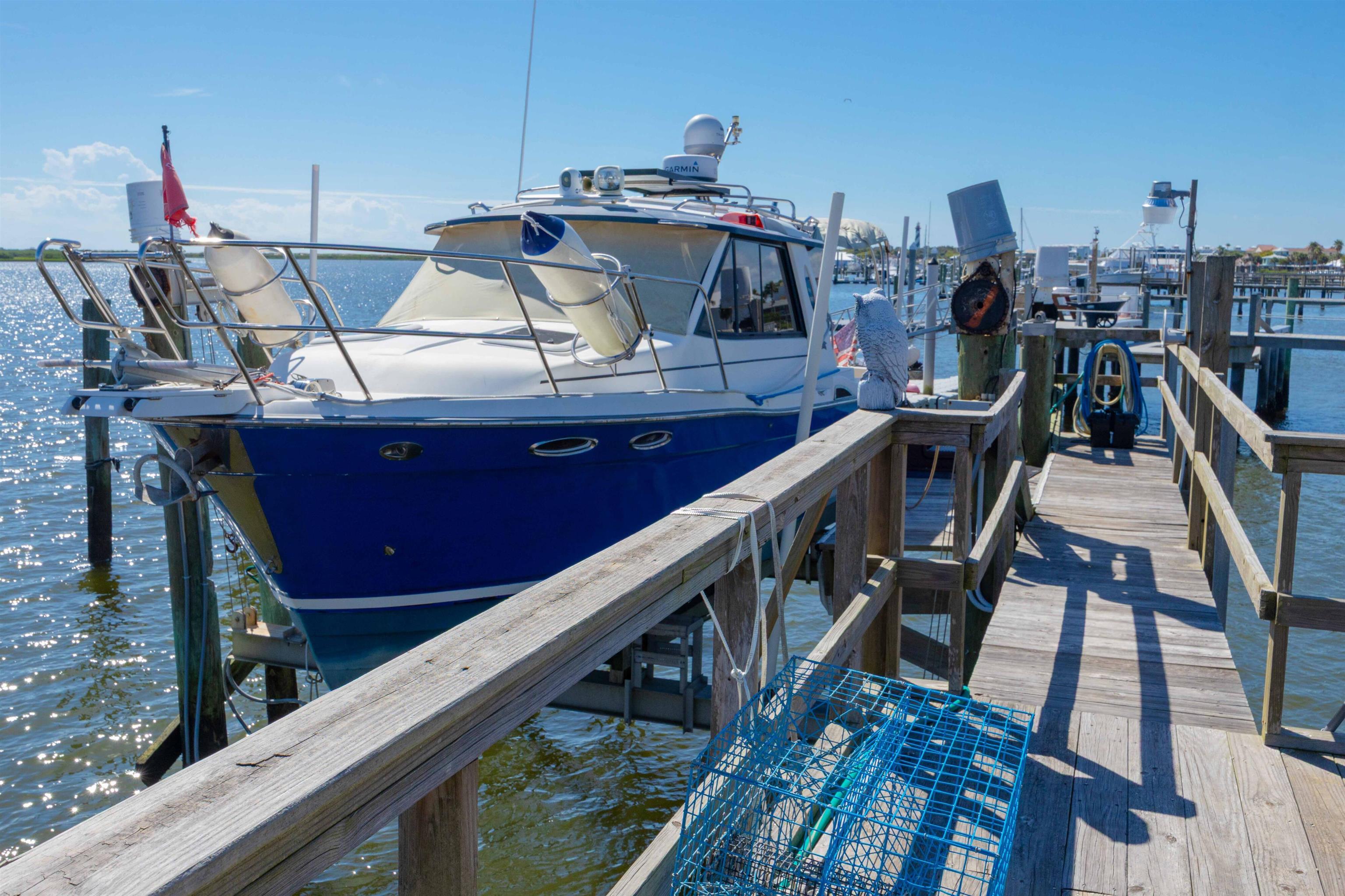 124 Inlet Drive St. Augustine, FL 32080 - Photo 16 of 45 Dock area with a water view and boat lift