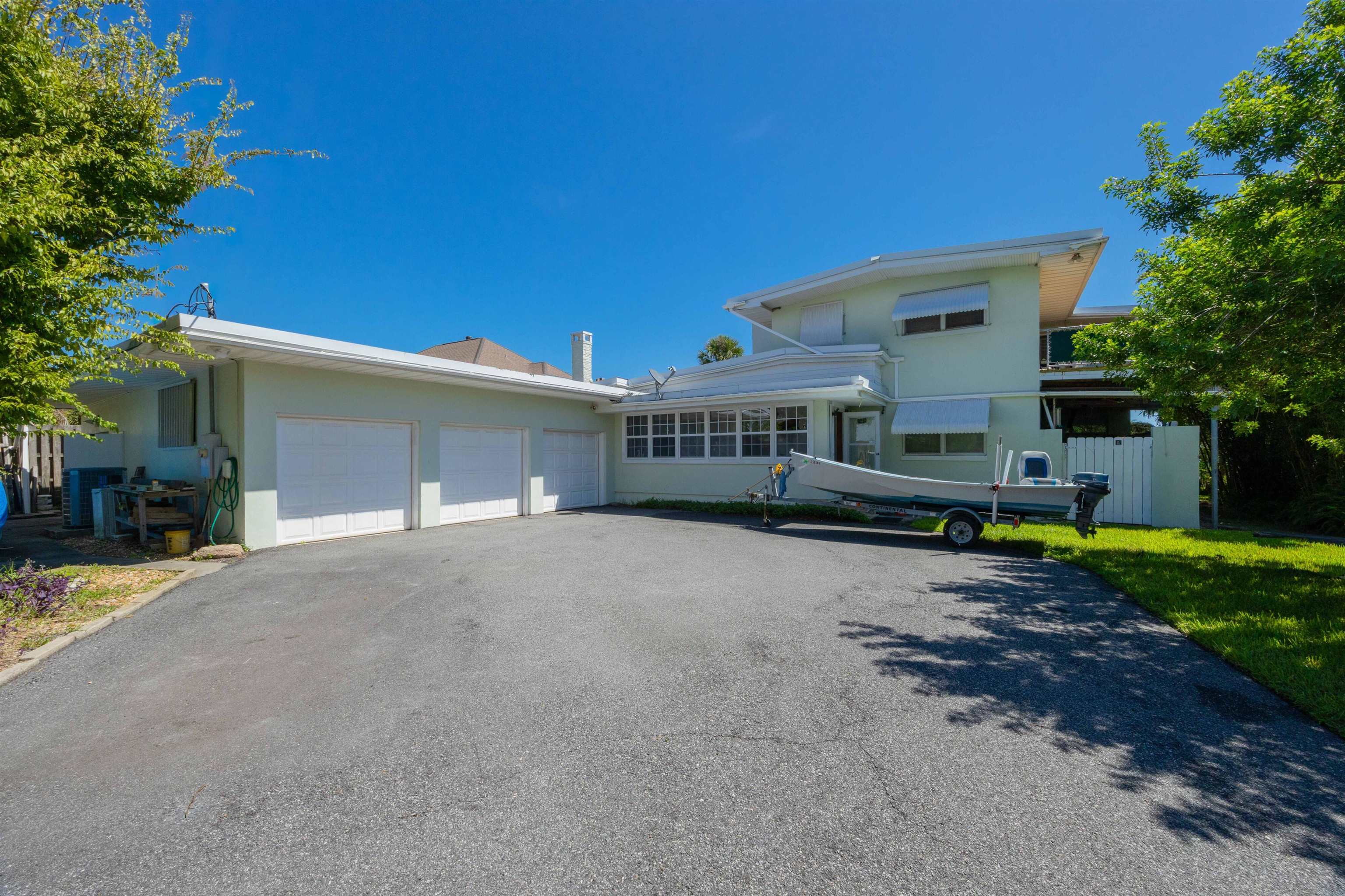 124 Inlet Drive St. Augustine, FL 32080 - Photo 22 of 45 a view of a house with a yard and potted plants