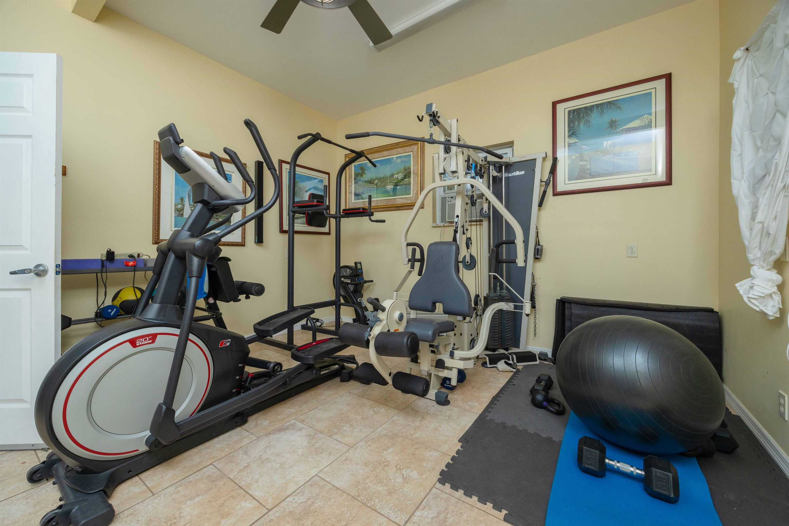 124 Inlet Drive St. Augustine, FL 32080 - Photo 25 of 45 Workout area with ceiling fan and tile patterned flooring