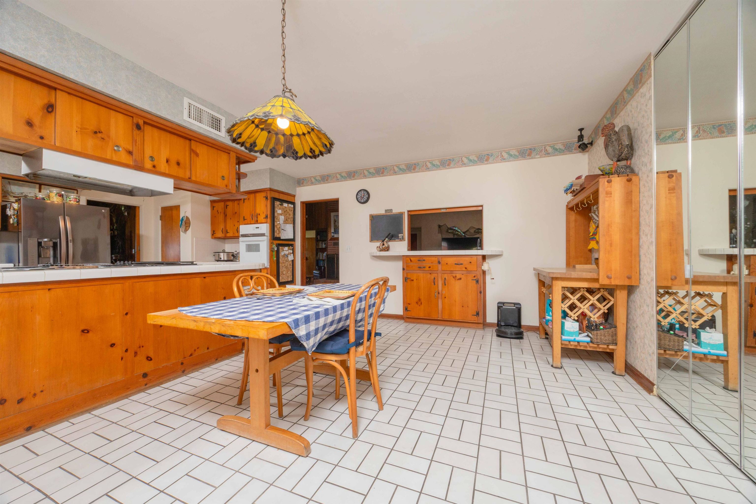 124 Inlet Drive St. Augustine, FL 32080 - Photo 33 of 45 a living room with furniture a dining table and chairs with kitchen view