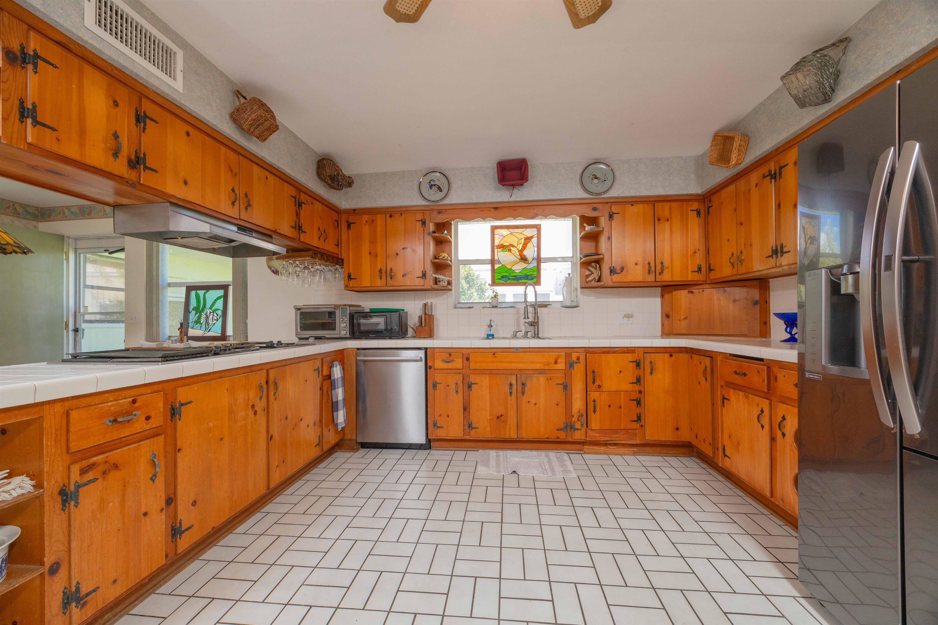 124 Inlet Drive St. Augustine, FL 32080 - Photo 34 of 45 a kitchen with stainless steel appliances a sink and a refrigerator