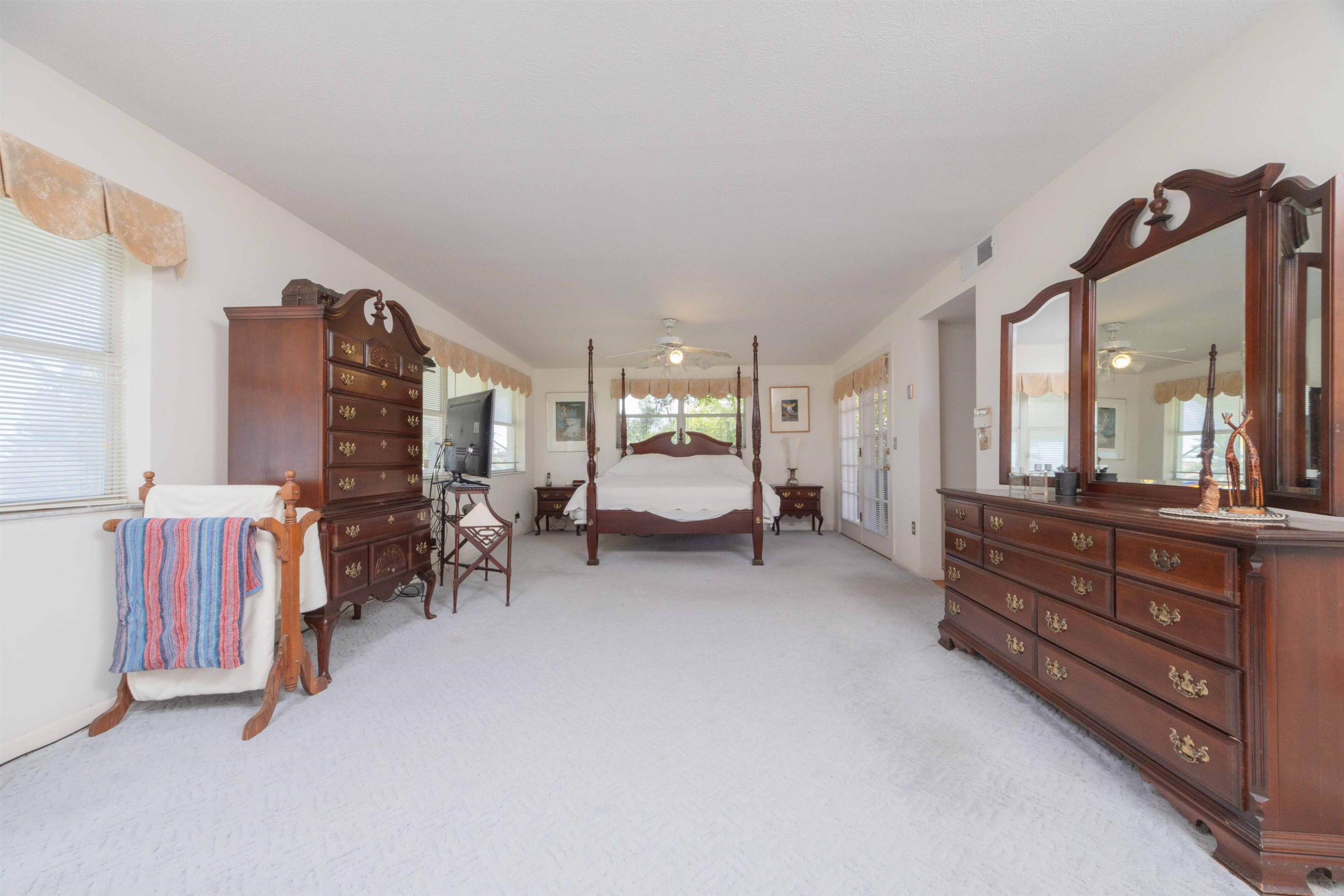 124 Inlet Drive St. Augustine, FL 32080 - Photo 39 of 45 a bedroom with furniture and a flat tv screen