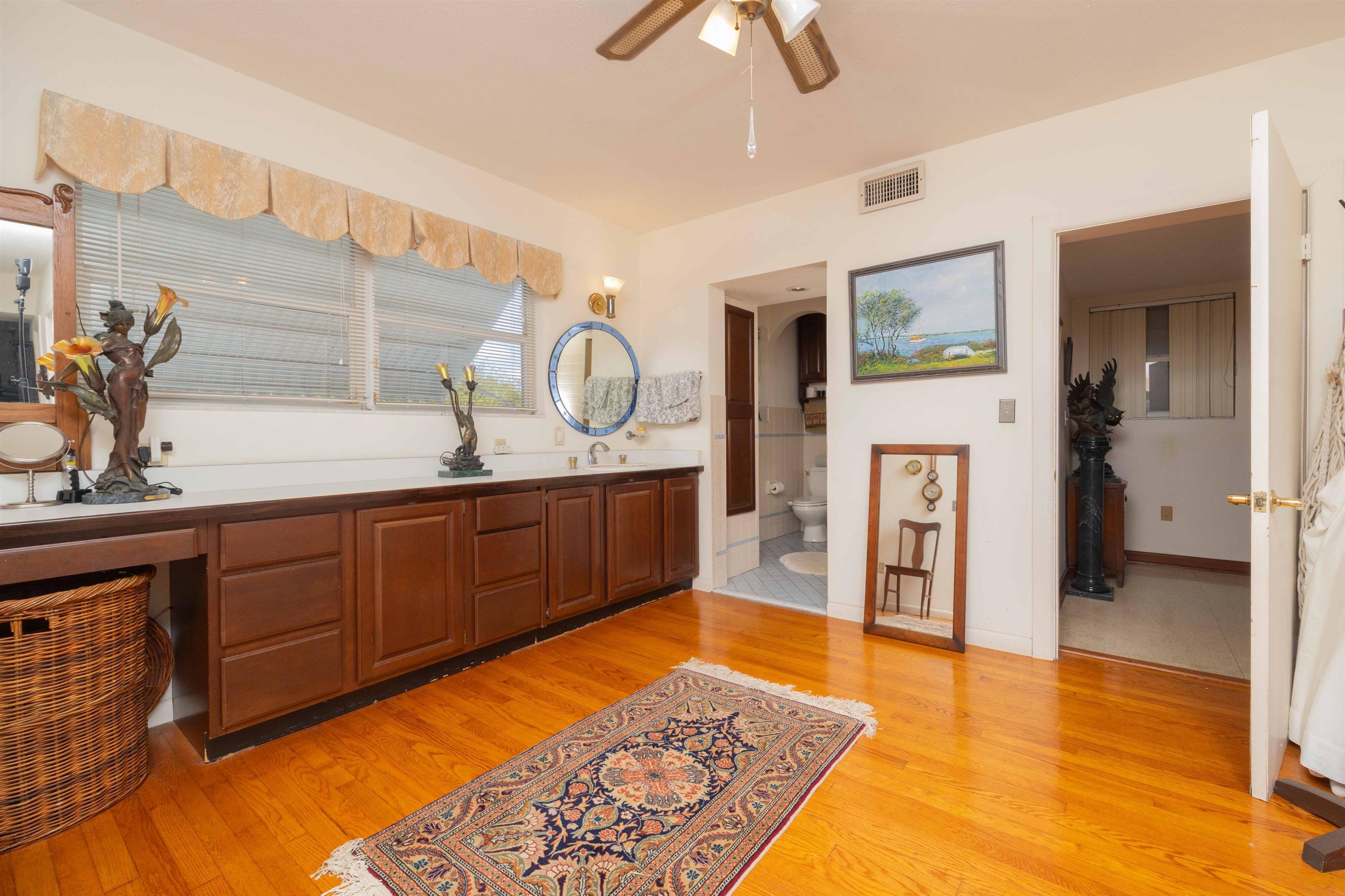 124 Inlet Drive St. Augustine, FL 32080 - Photo 41 of 45 a large bedroom with a bed and wooden floor