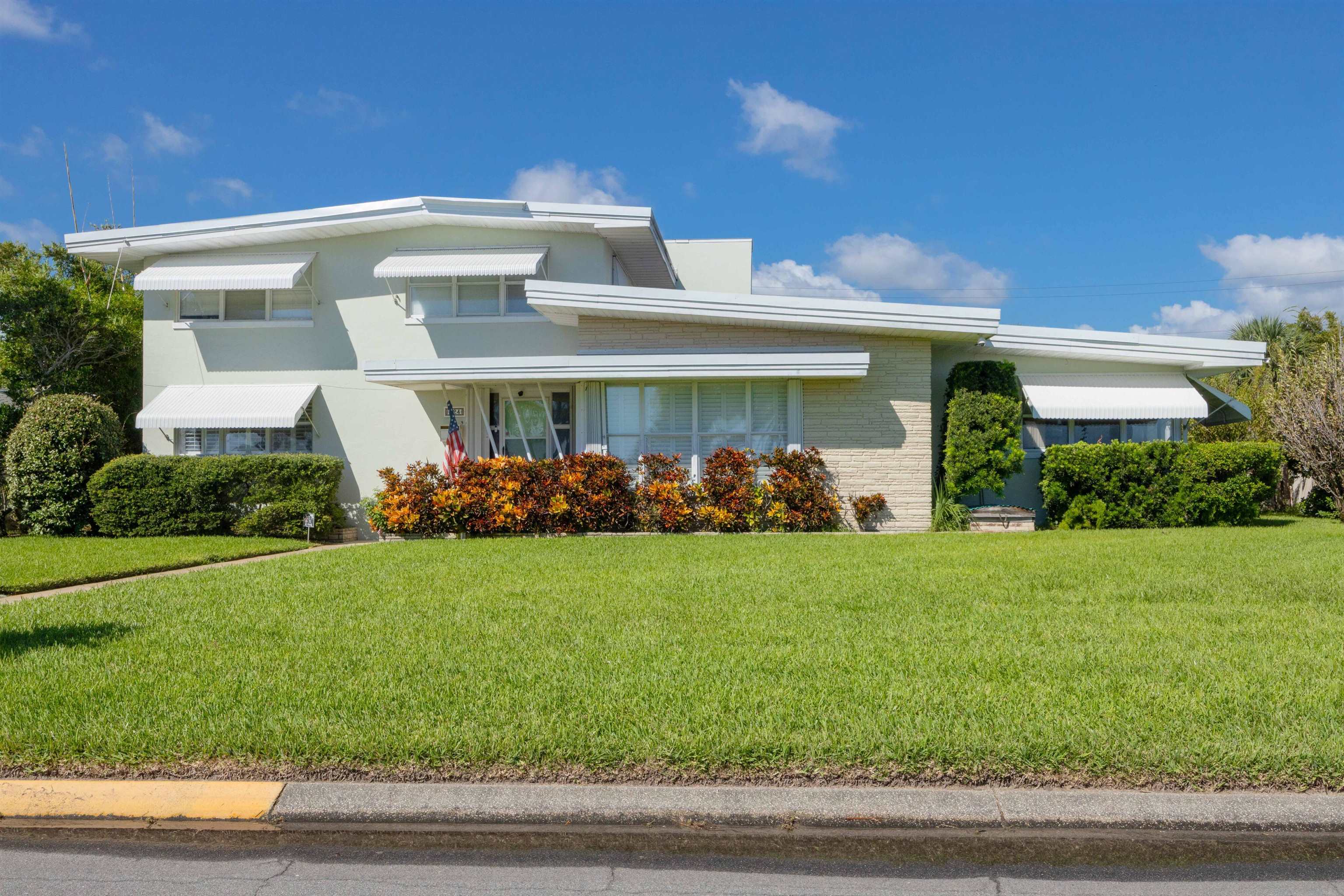 124 Inlet Drive St. Augustine, FL 32080 - Photo 6 of 45 a front view of a house with a yard
