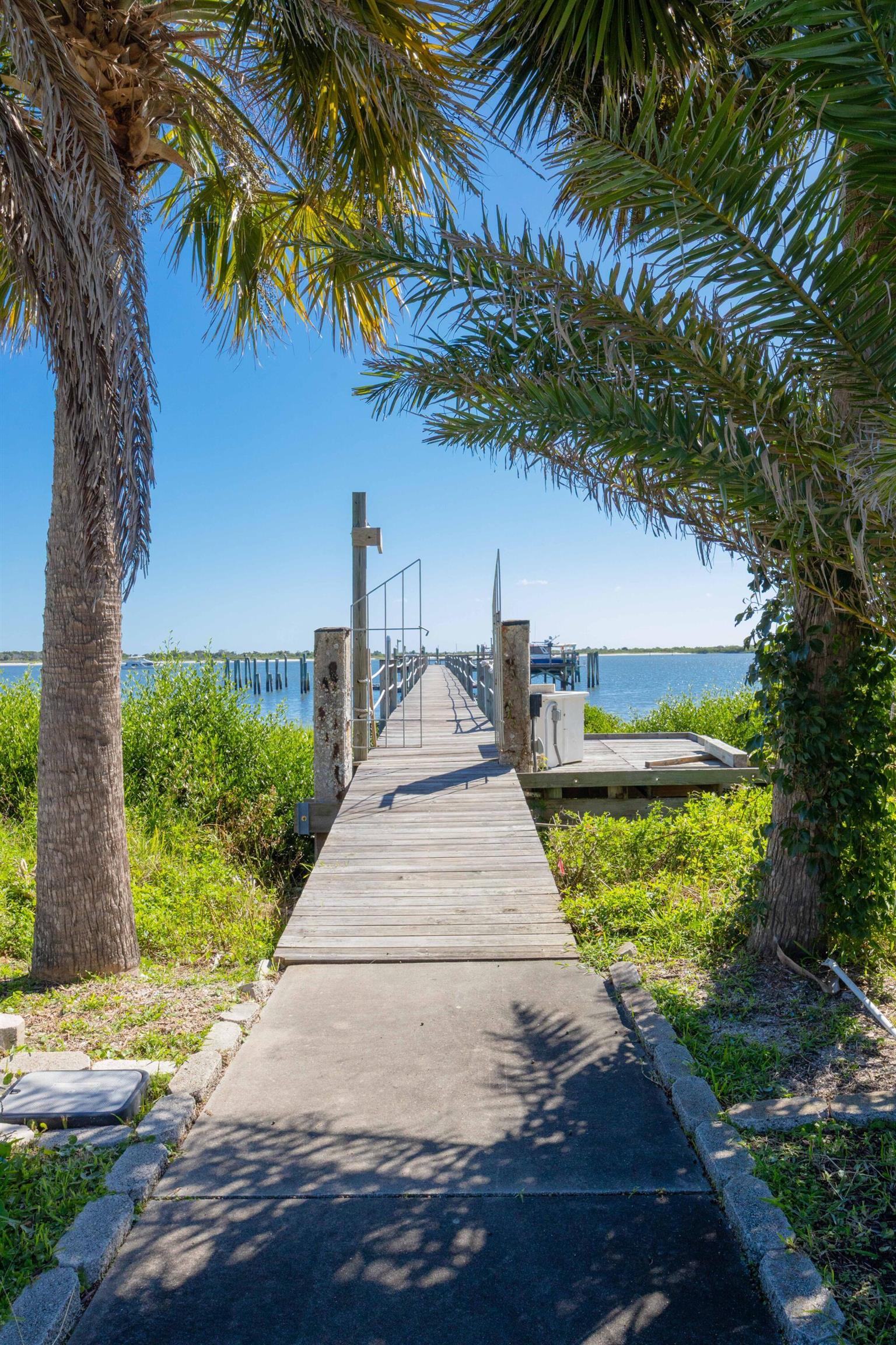 124 Inlet Drive St. Augustine, FL 32080 - Photo 9 of 45 a front view of a house with a yard