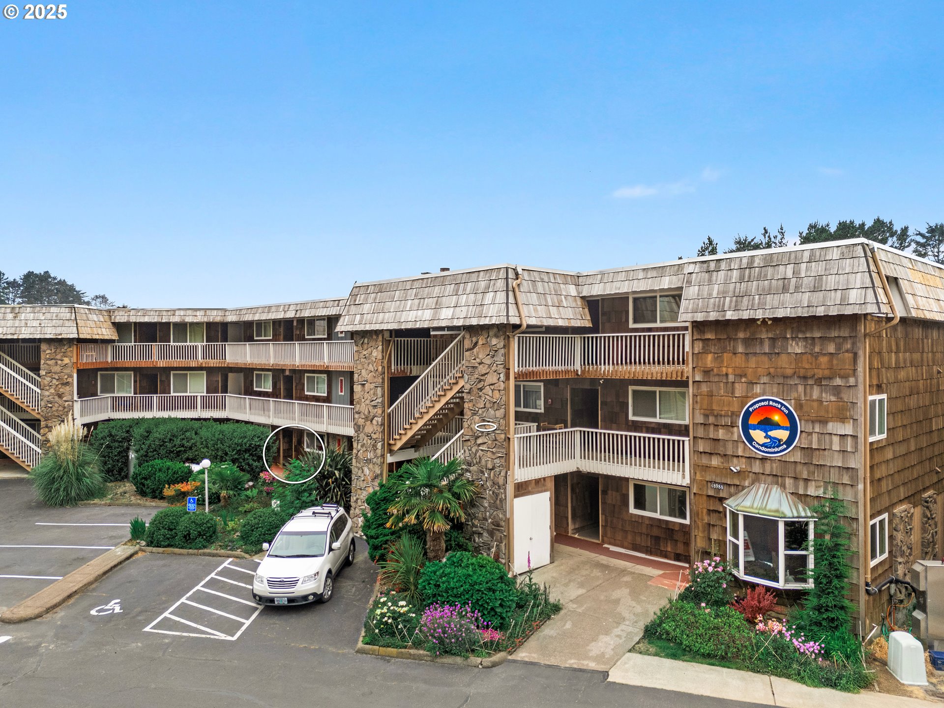 48988 Highway 101, Unit 137F Neskowin, OR 97149 - Photo 1 of 29 a front view of a building with garden
