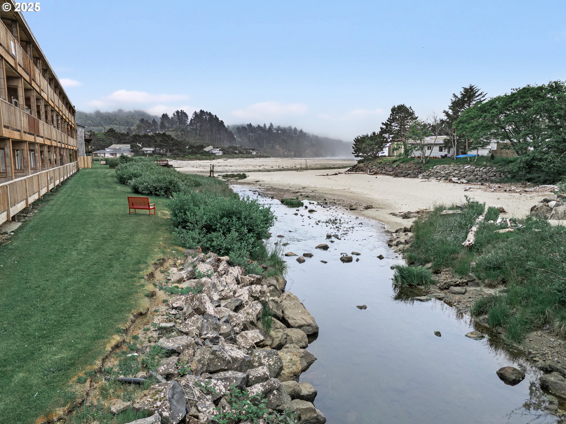 48988 Highway 101, Unit 137F Neskowin, OR 97149 - Photo 13 of 29 a view of a lake with beach and city view