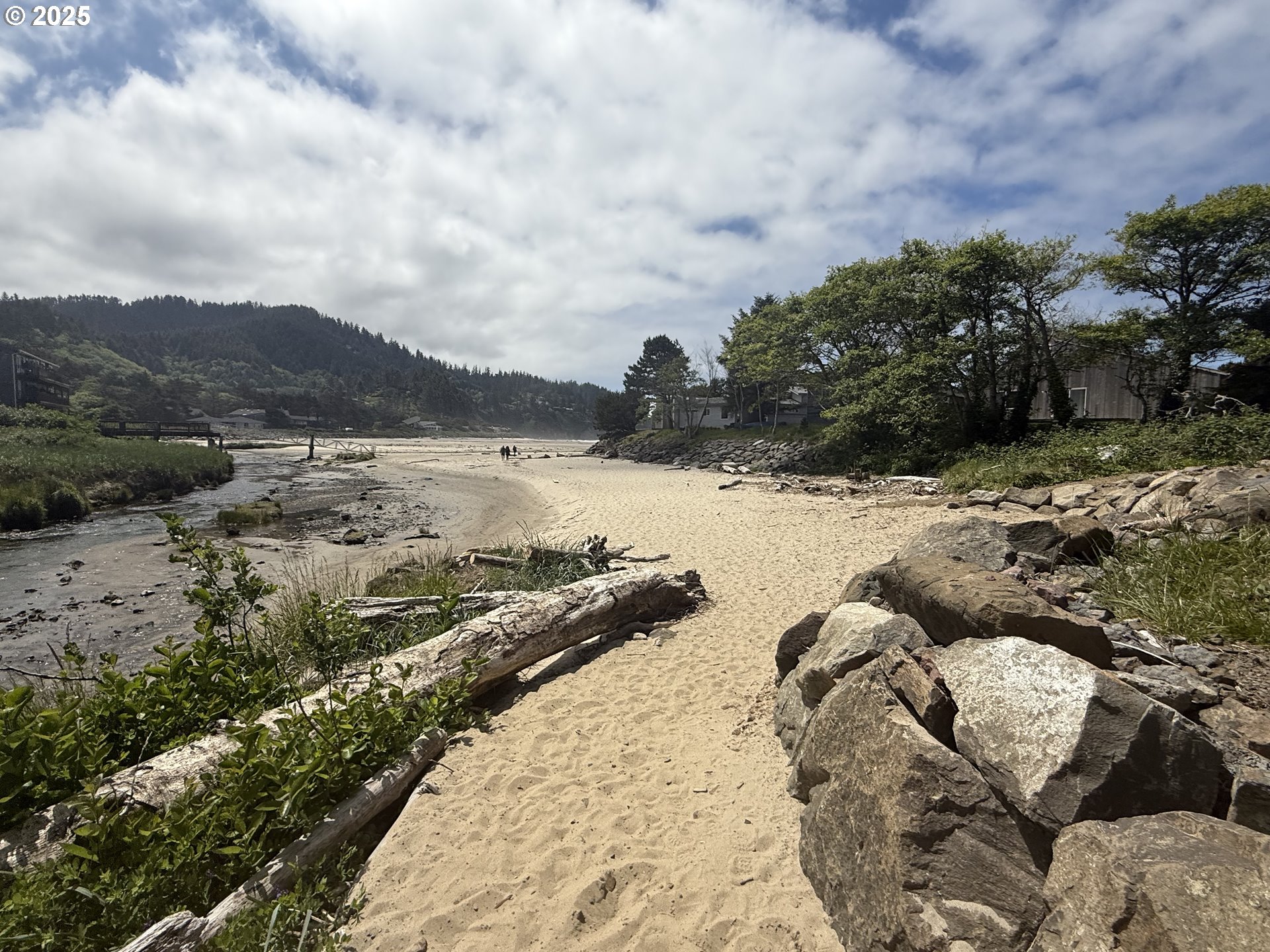 48988 Highway 101, Unit 137F Neskowin, OR 97149 - Photo 14 of 29 a view of a lake with mountains in the background
