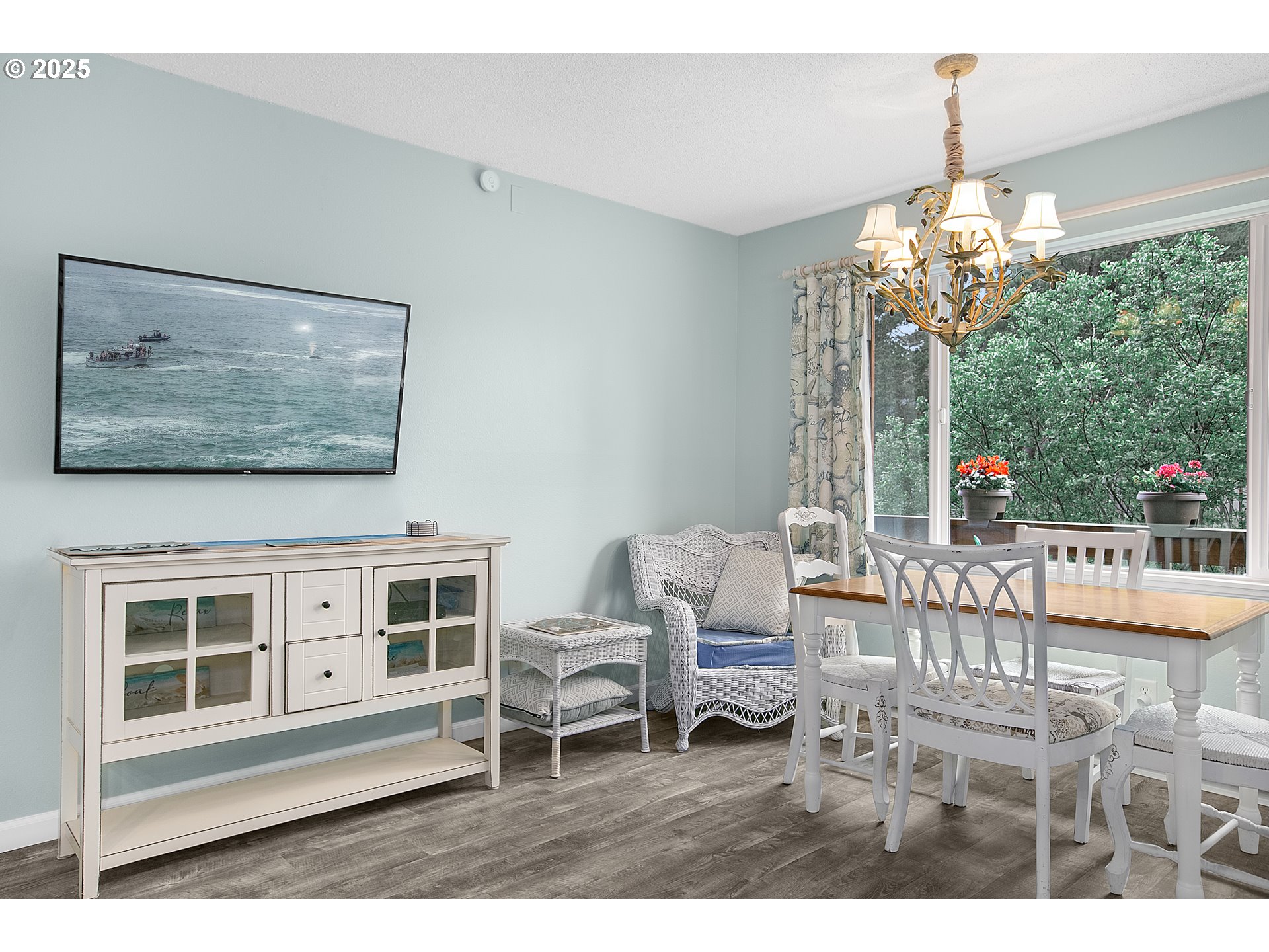 48988 Highway 101, Unit 137F Neskowin, OR 97149 - Photo 5 of 29 a living room with furniture and a chandelier