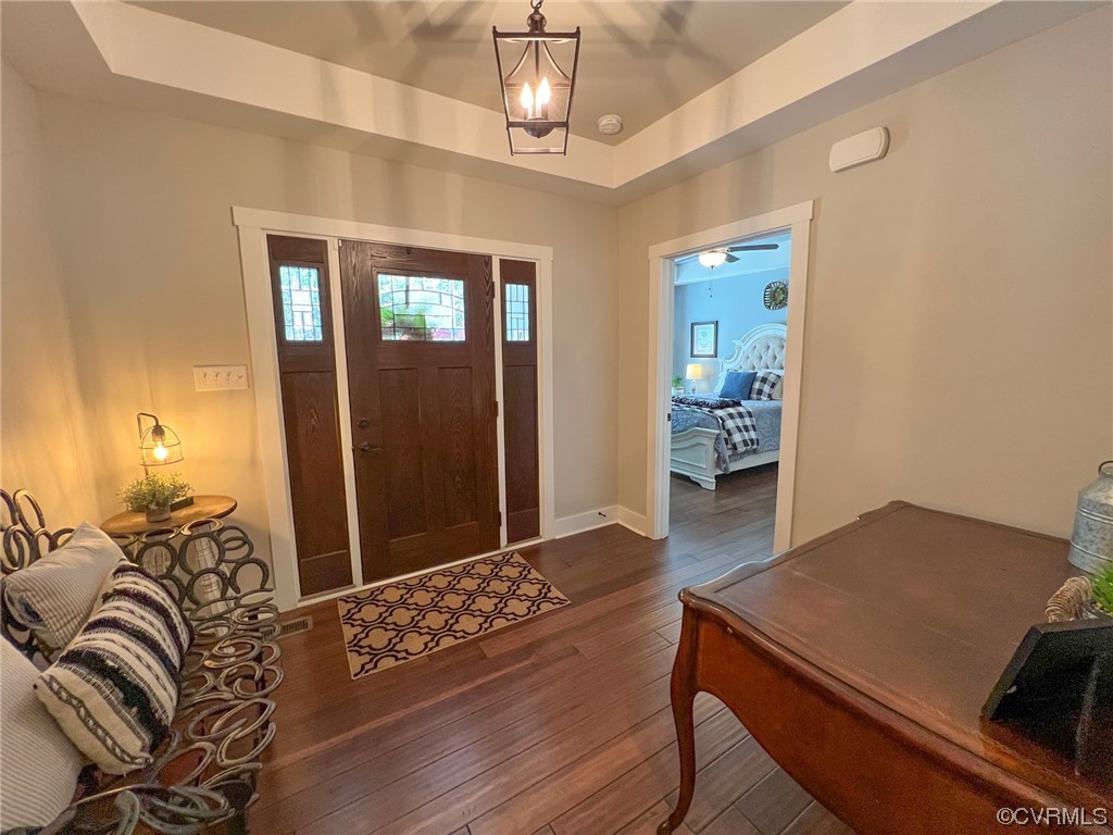 307 Country Club Road Crewe, VA 23930 - Photo 3 of 50 a living room with furniture and a chandelier