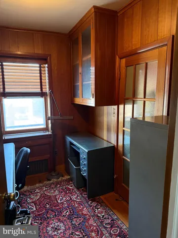 a living room with a fireplace furniture and a window