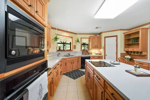 a kitchen that has a sink and a stove