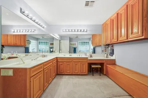 a kitchen with stainless steel appliances granite countertop a sink and cabinets