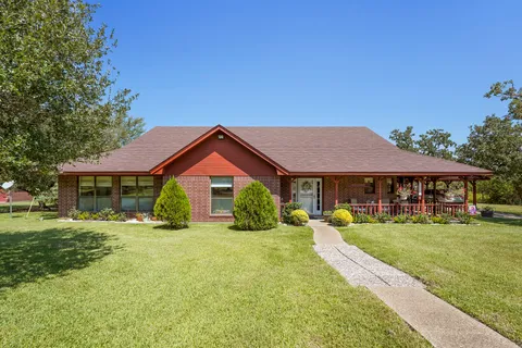 a view of a house with a big yard