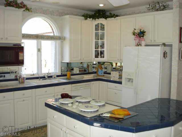 204 Helsabeck Road King, NC 27021 - Photo 8 of 9 Other. Kitchen features built-in oven & microwave as well as a cooktop. Tile counters makes it easy to clean and gorgeous.