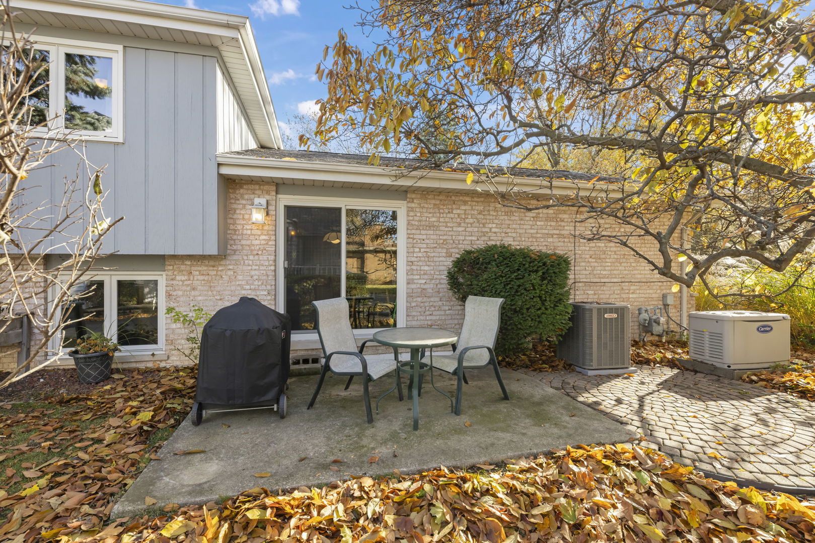 3068 Hickory Road Homewood, IL 60430 - Photo 25 of 44 a view of a patio with table and chairs near a barbeque